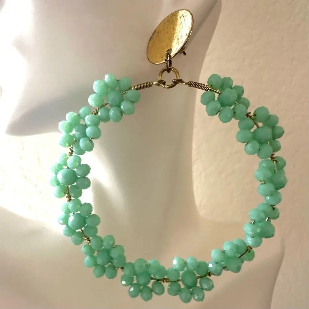 Large green floral circle statement earrings